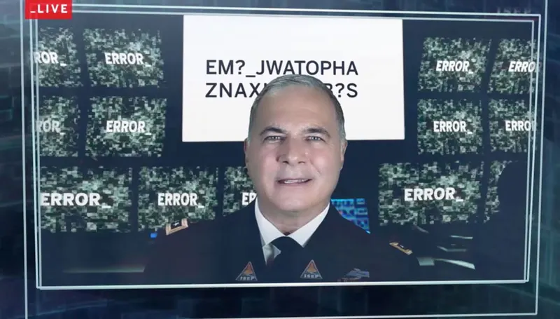 Live broadcast still: admiral in front of error screens